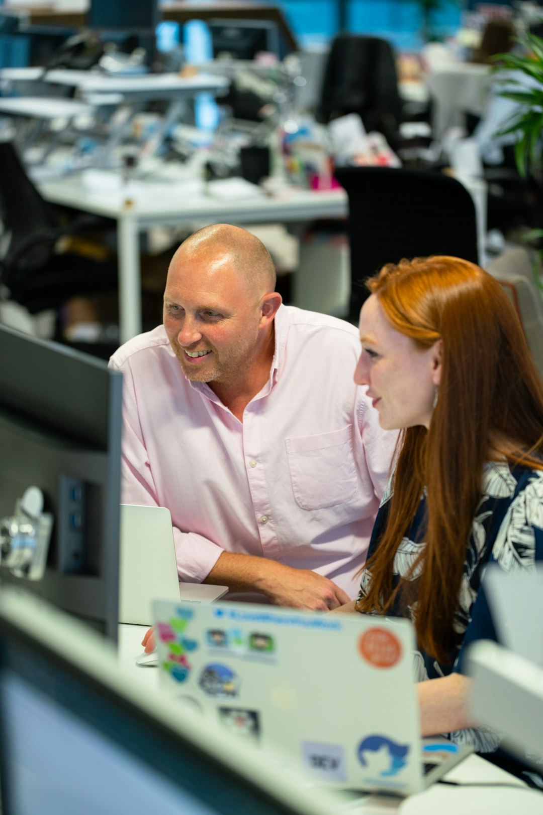 Female software engineer in discussion with colleague
